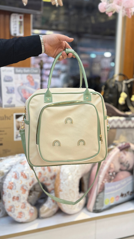 ساک لوازم نوزاد دوشی چرم با گلدوزی رنگینکمان برند Arina Room